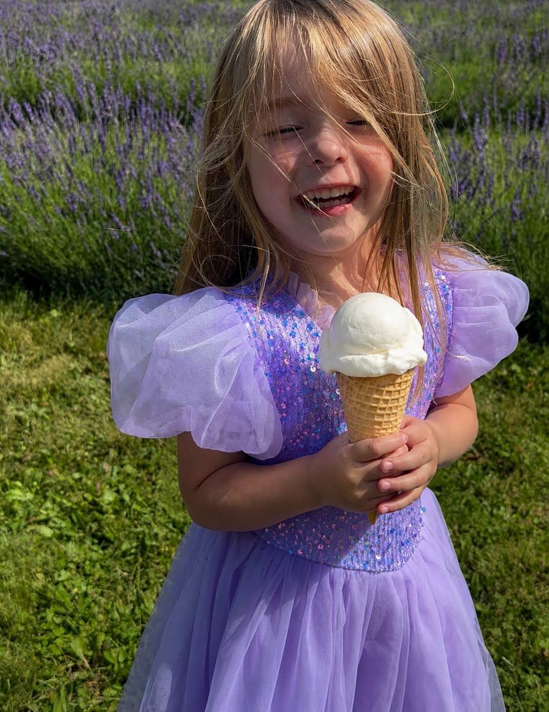 A child with an ice cream cone at the free ice cream social at Wilderness Valley Farm in Gaylord, Michigan